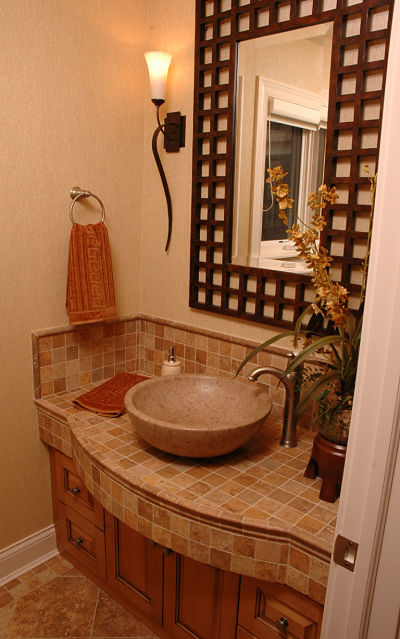 half-bath-with-tile-counter-and-backsplash