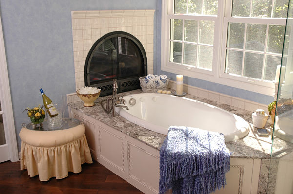 two-sided-arched-fireplace-in-bathroom