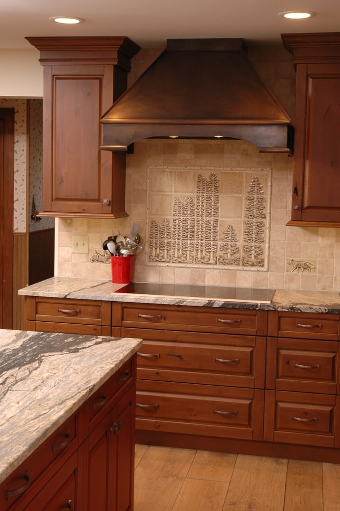 This example of a copper hood used in a traditional kitchen shows how a contemporary piece can update a traditional look.