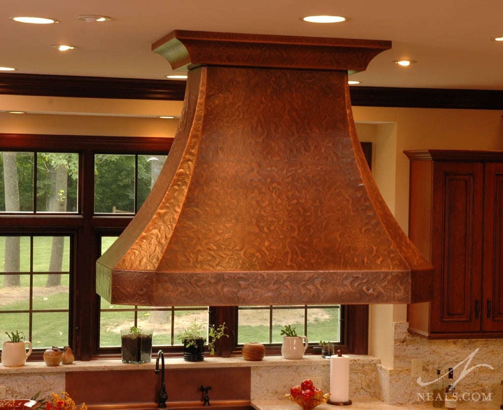 Custom copper hood over the island helps create the show-stopping view.