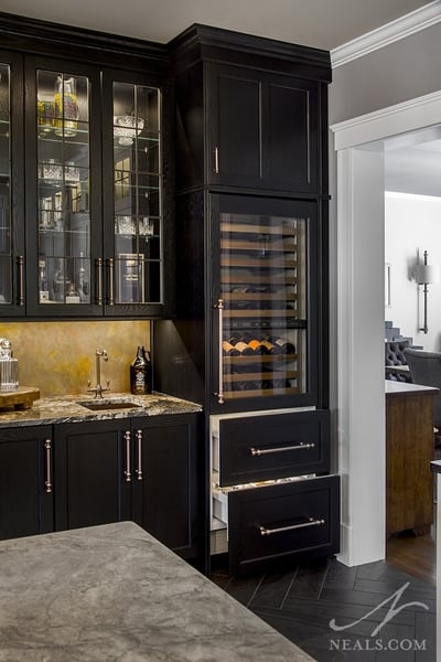The three different pulls used in this wet bar design are untied by finish and general shape.