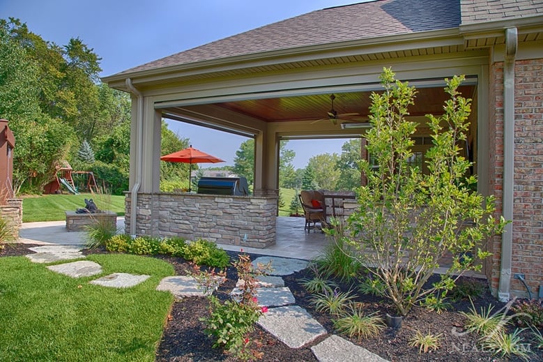 A simple stone walkway helps visitors to this back yard project know they have options for where they can go.