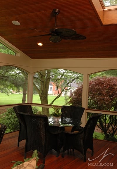 The design of this screened-in porch helps with air circulation, making mid-summer poker night more comfortable.