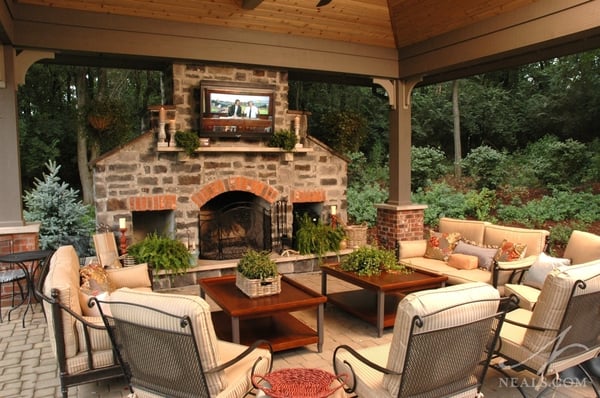A fireplace and TV under this large pavilion create a great place to hang out and still enjoy the outdoors.
