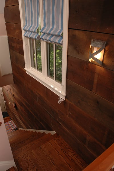 The wood used in the stairwell in this two-story garage was salvaged from the old garage that originally stood here.