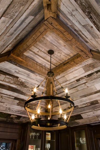 This ceiling was created using two types of recaimed wood to add depth and interest.