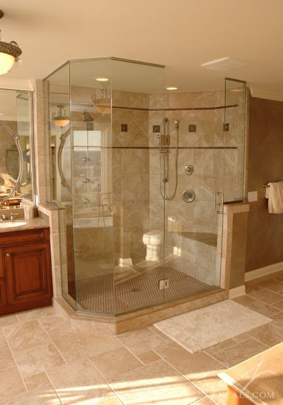 A large custom shower offers plenty of comfort and amenities.
