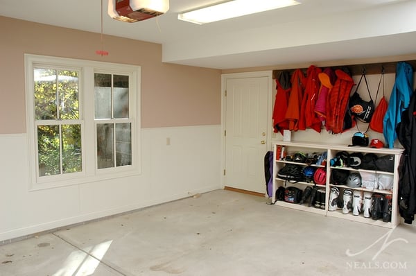 Winter gear is put away neatly in this garage, so that summer coats, shoes and gear has room closer to the action inside.