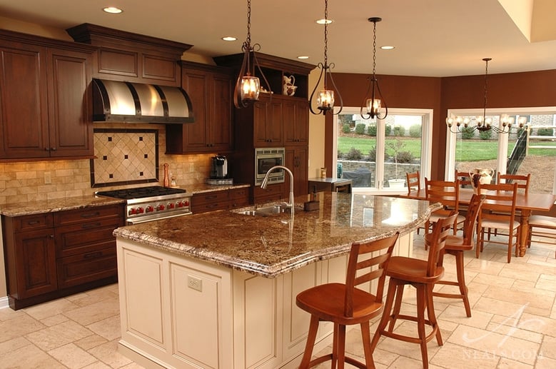 A black glaze over the brown stain on these wall cabinets brings out the door profile and diffuses the natural light so that the texture of the cabinets can be seen and enjoyed, rather than washed out with glare.