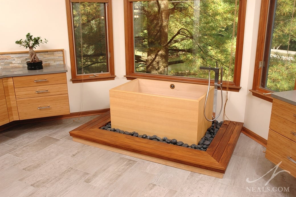 A neutral mix of warm woods, pale bamboo, and light cream walls helps to convey the Japanese infuences in this Sycamore Township master bathroom.