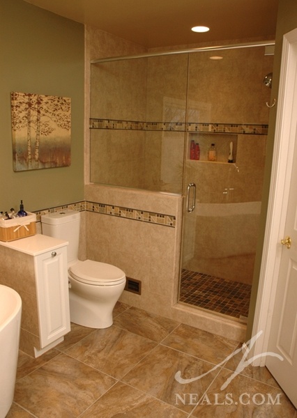 The tile scheme in this bathroom creates a cohesive style that sets the tone in this relaxing, naturally-inspired space.