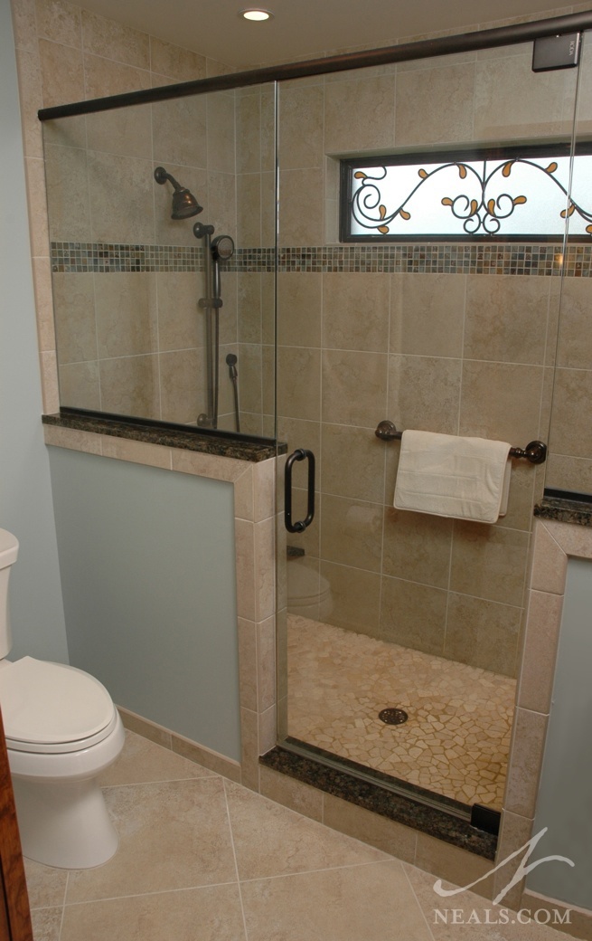 By sticking with a cream and brown palette, the various tiles in use in this bathroom compliment each other, but add visual interest.