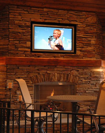 ledgestone outdoor fireplace with wood mantel