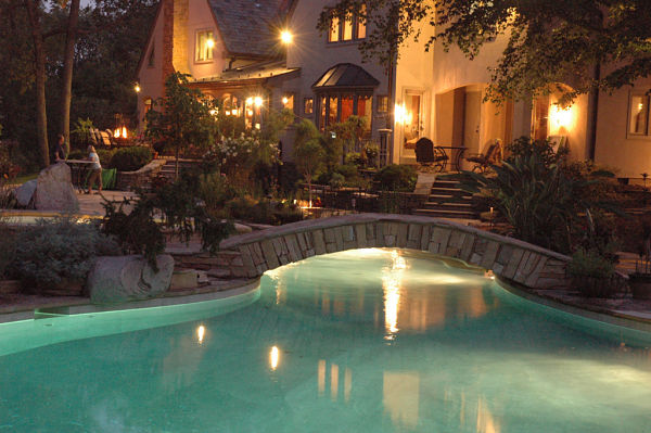 backyard pool landscaping and night lighting
