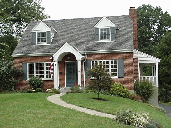 cape cottage with white portico