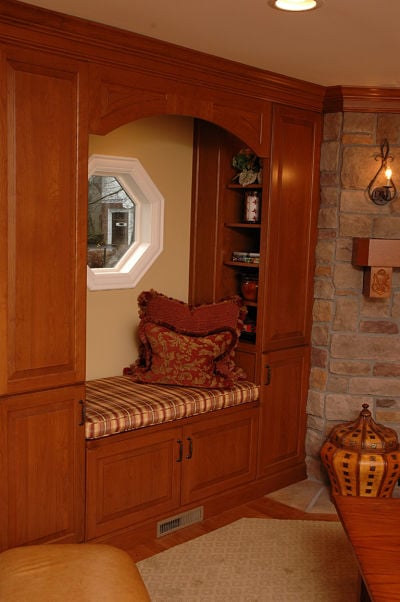 custom window seat with cabinets