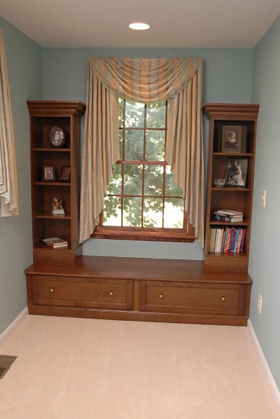 window seat with built-in display cabinets