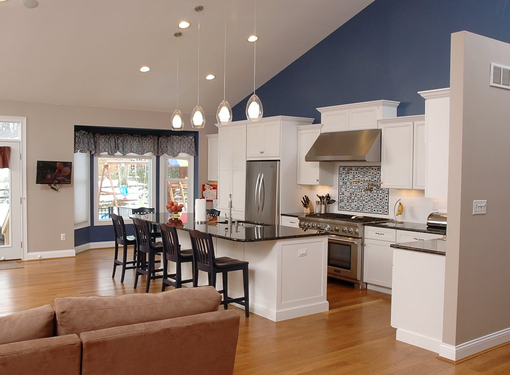 A bold blue helps the white cabinets in this kitchen remodel stand out.