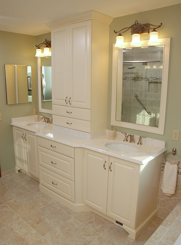 A light green, like Guilford Green, works behind the mirrors in this bathroom remodel.