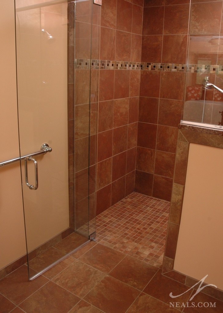 Universally-designed bathrooms place saftey and ease of use first, such as in this master bathroom with a curbless walk-in shower.