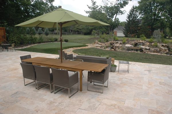 stone patio with water feature and putting green