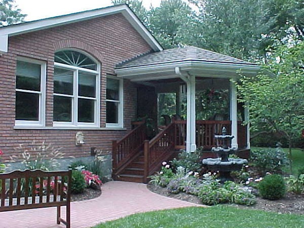 sheltered porch with fountain and gardens