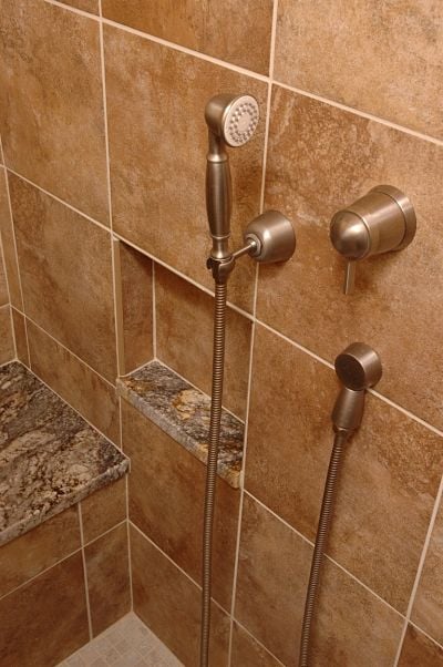 https://info.neals.com/hs-fs/hub/188145/file-304573474-jpg/images/adjustable-height-handheld-shower.jpg