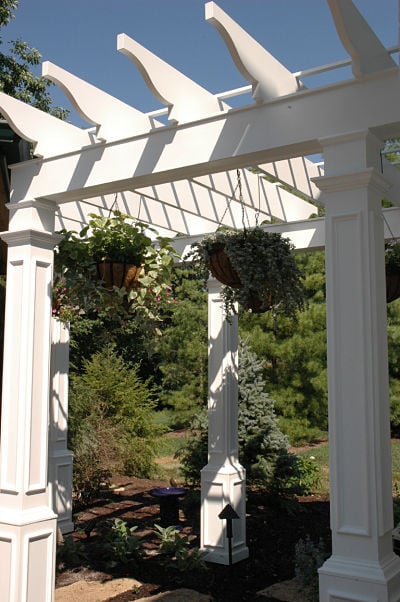 white arbor with ten-foot support columns