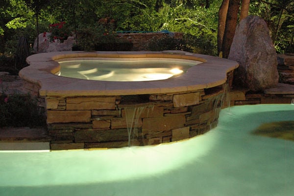 custom hot tub flowing into pool