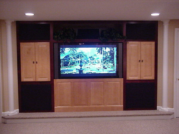 basement home theater with custom cabinets