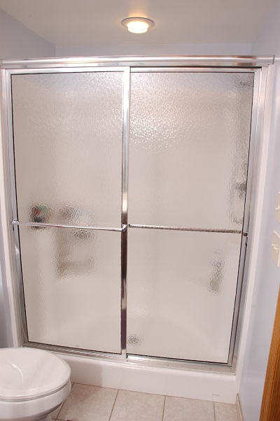 walk-in shower with sliding doors