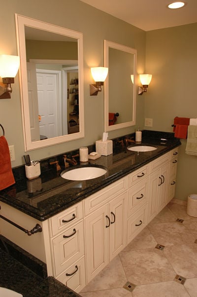 bathroom vanity with two sinks and mirrors