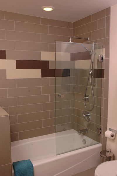 tub and shower with tile surround