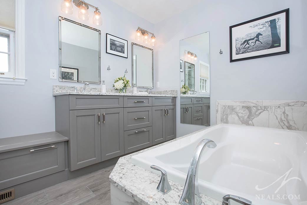 The tub in this Anderson Township bathroom is specially contoured for soaking comfort.