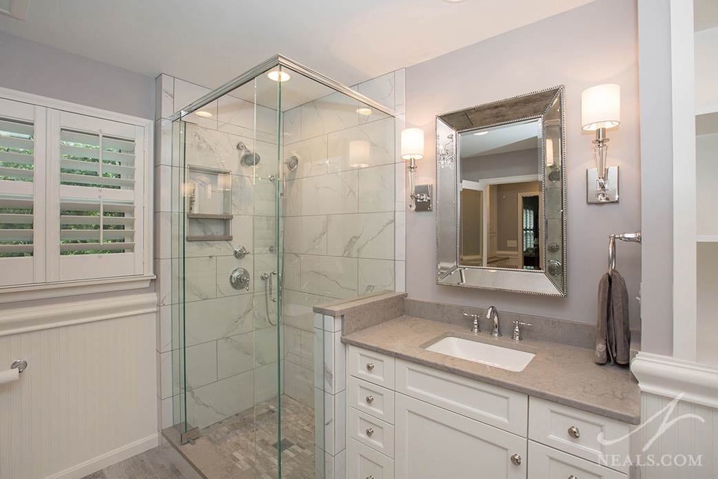 A marble-look porcelain tile was used in the shower for this country chic Indian Hill master bath.