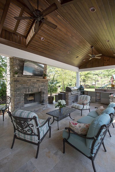 outdoor living area with roof and fireplace