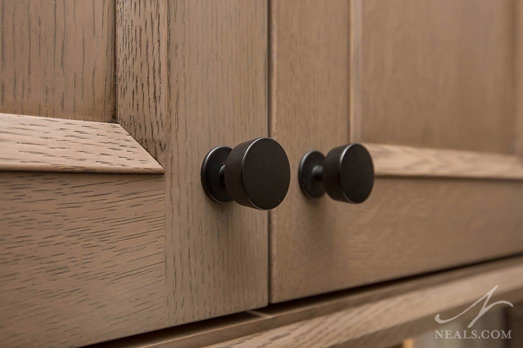 Matte black hardware in a minimalist style in a Loveland kitchen remodel.