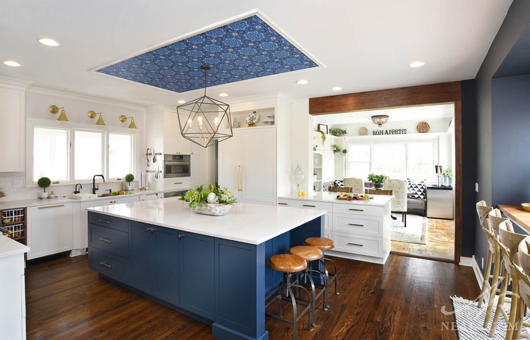 kitchen with a modern chandelier and three wall-mounted lights