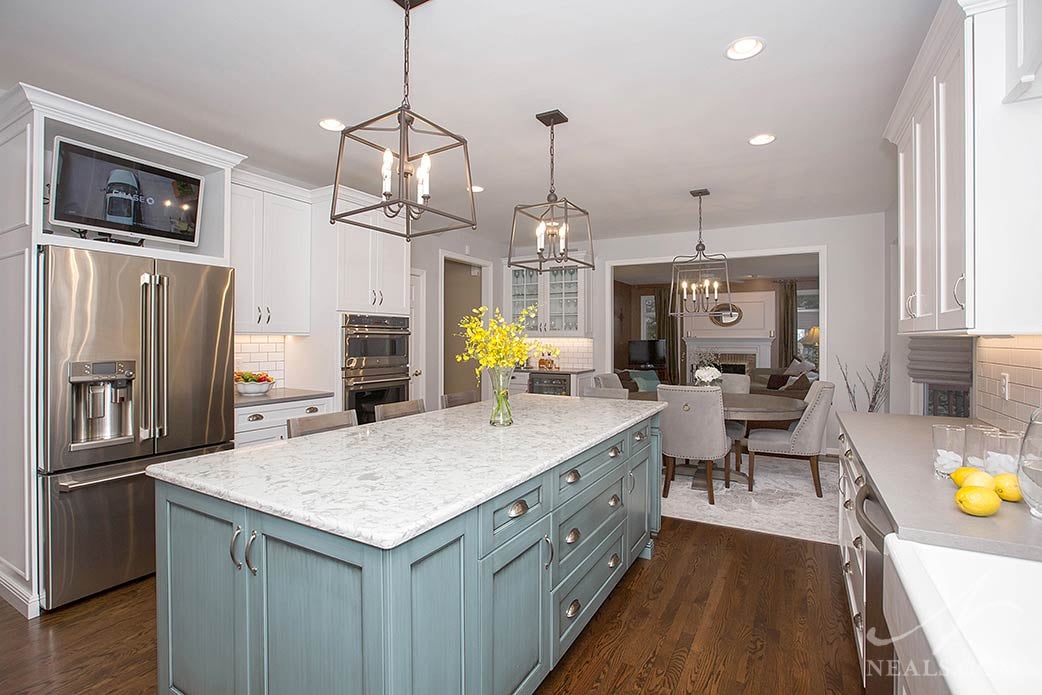 Transitional kitchen white with blue island