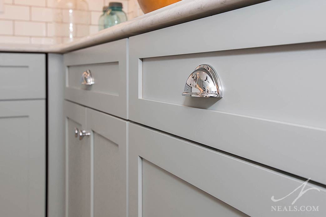 Reflective polished nickel knobs in an Avondale kitchen remodel.