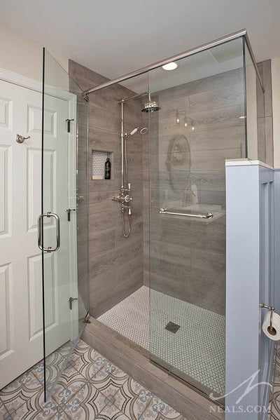 walk-in shower with wood look tile
