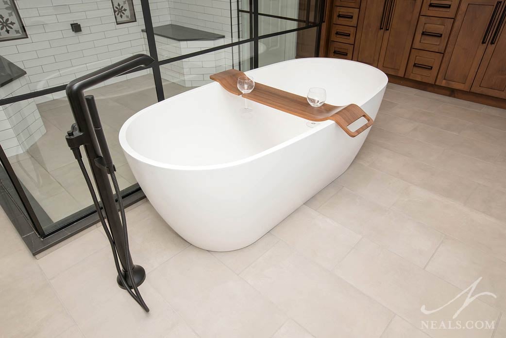 minimalist soaking tub and floor mounted faucet