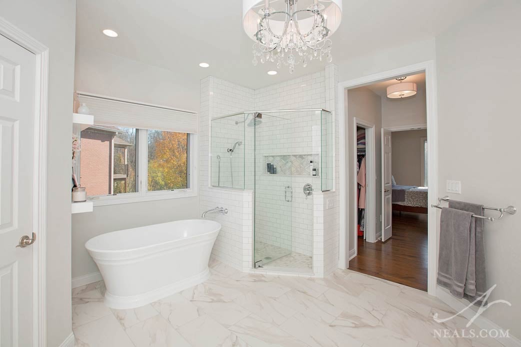 master bathroom with a transitional style free-standing tub