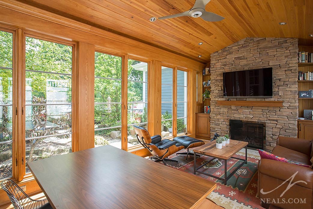  Instead of a bold paint, the wood-clad walls of this sunroom in Madeira capture the warmth of 2019s trending oranges.