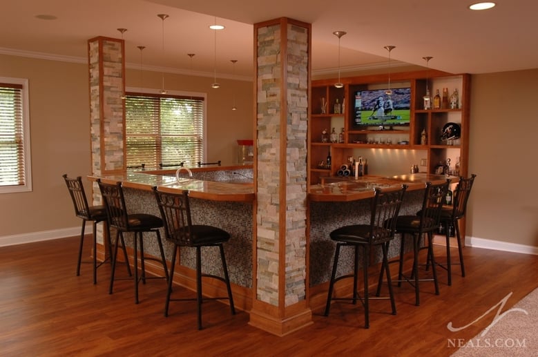 Within this lower level kitchen there is natural light that illuminates the room during the day, and task lighting over counter areas. Bar shelves are also illuminated so that contents can be easily seen and for ambiance.