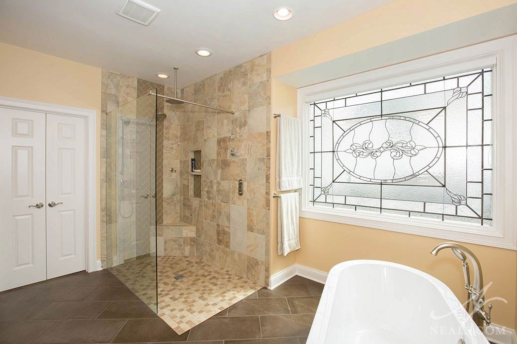 A frosted leaded glass window in this Sycamore Township bath adds natural light without compromising privacy.