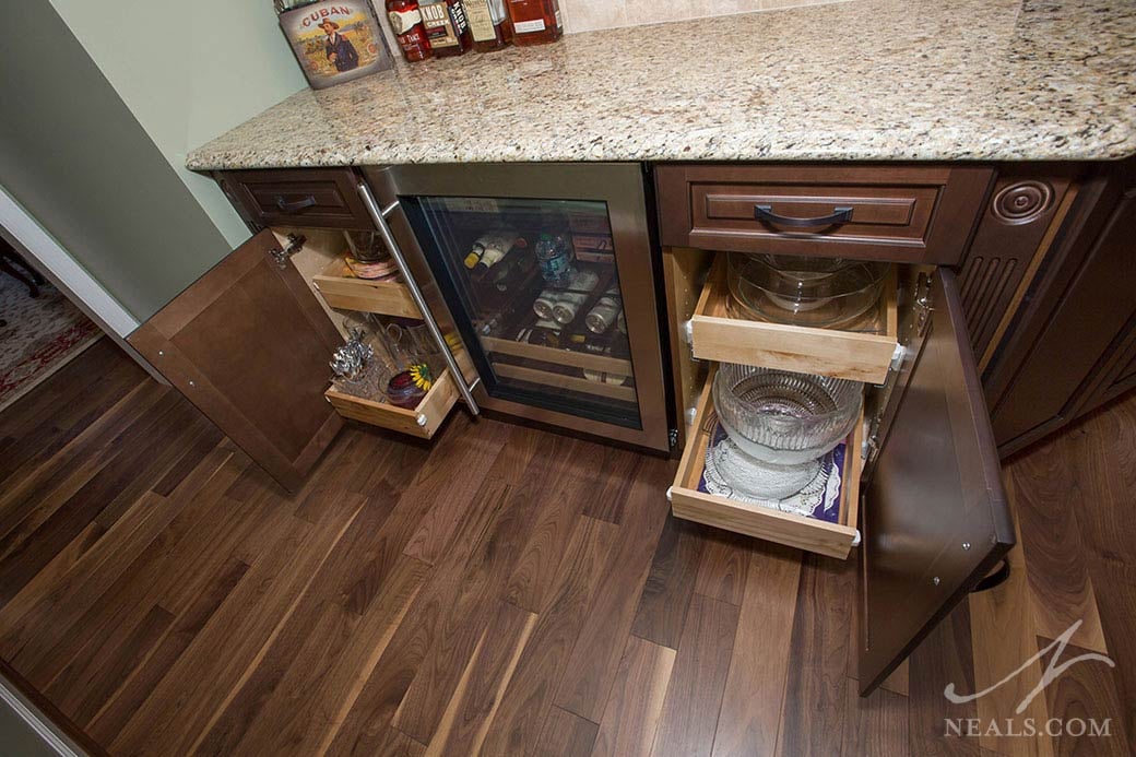 Quality can be observed in kitchen cabinets by looking at the interiors, like the pullout drawer cabinets in this Loveland kitchen.