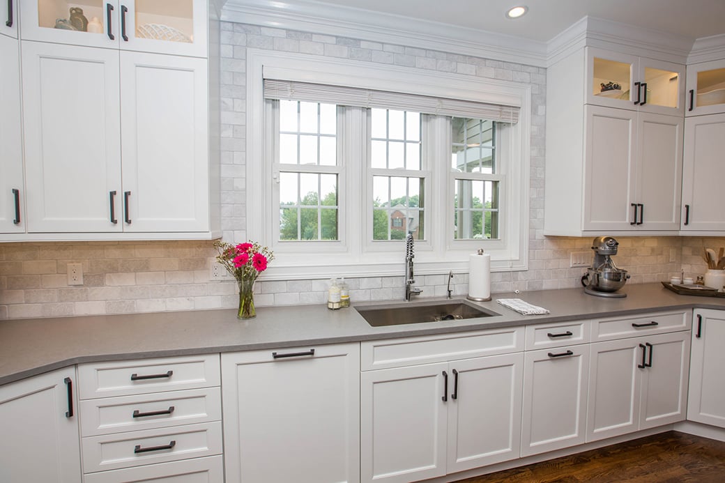 This family kitchen in Loveland balances several white elements with other neutrals.