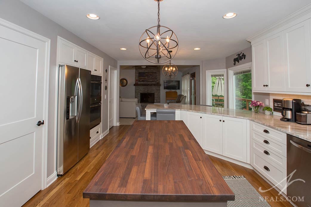 In line with over a century of tradition, the island in this West Chester kitchen is a sophisticated black walnut butcher block.