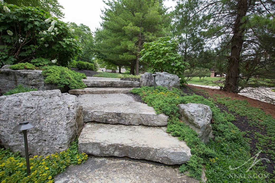 Boulders added to the landscaping in a Western Hills outdoor project.